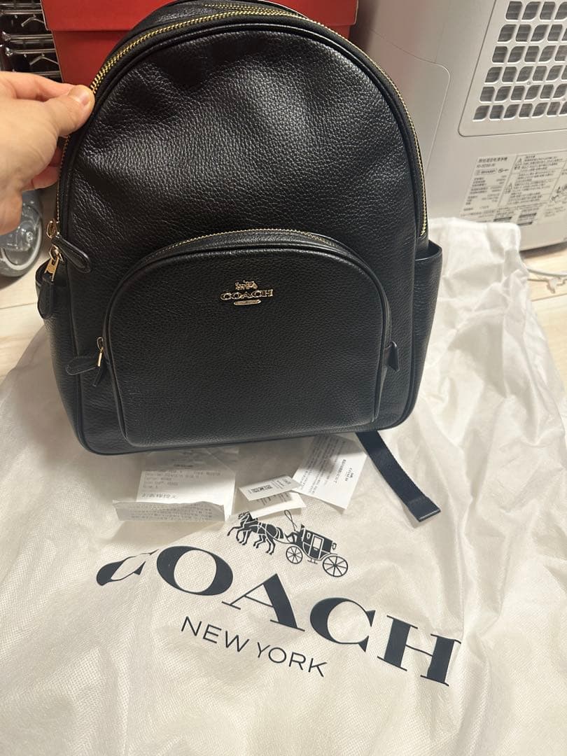 COACH PEBBLED LEATHER COURT BACKPACK